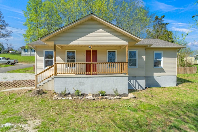 146 Sandy Hill Rd, Lafollette, TN 37766 - bungalow-style house with roof with shingles, a front yard, crawl space, and covered porch