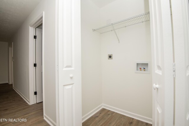 washroom featuring laundry area, wood finished floors, hookup for an electric dryer, baseboards, and washer hookup