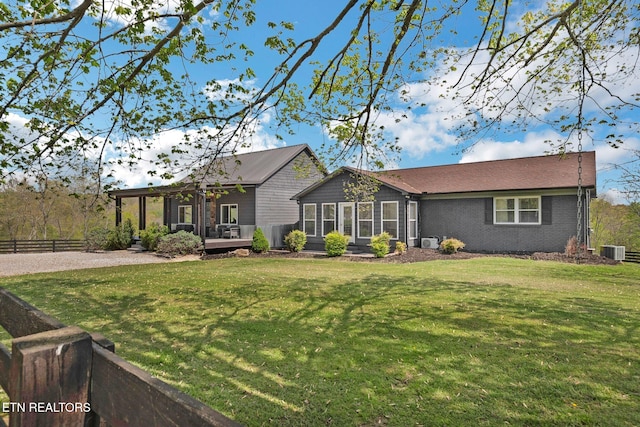 544 Mill Creek Rd, Andersonville, TN 37705 - view of front of home with central AC, a front lawn, fence, and a deck