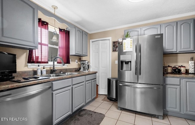 544 Mill Creek Rd, Andersonville, TN 37705 - kitchen featuring stainless steel appliances, gray cabinets, a sink, light tile patterned flooring, and crown molding