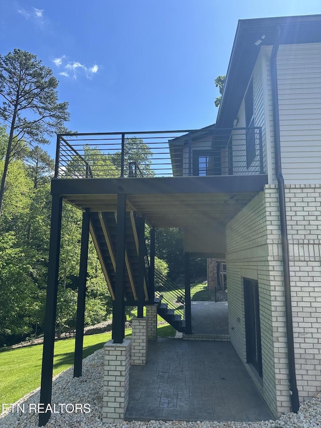 view of home's community featuring stairway and a deck