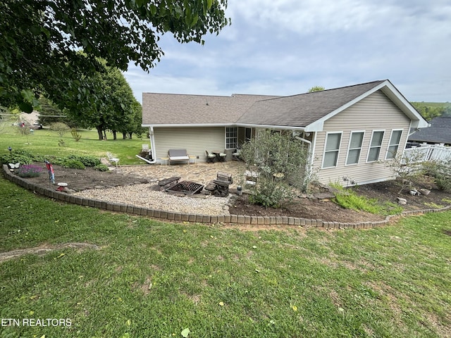 2525 Virgil Rushing Way, Knoxville, TN 37914 - back of property with a yard, a shingled roof, a patio, and an outdoor fire pit