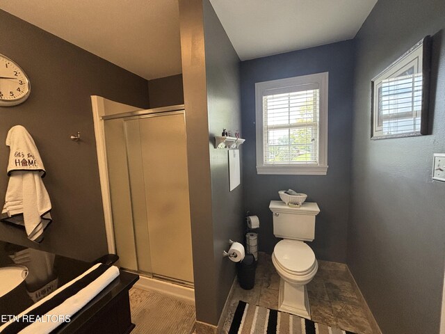 2525 Virgil Rushing Way, Knoxville, TN 37914 - full bathroom featuring a shower stall, toilet, vanity, and baseboards