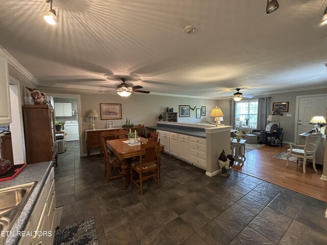 2525 Virgil Rushing Way, Knoxville, TN 37914 - dining space with baseboards, ornamental molding, ceiling fan, and washer / dryer