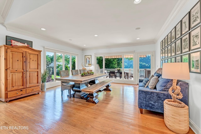 dining area with recessed lighting, ornamental molding, and light wood finished floors