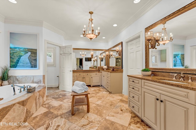 bathroom with a sink, ornamental molding, a garden tub, and a notable chandelier