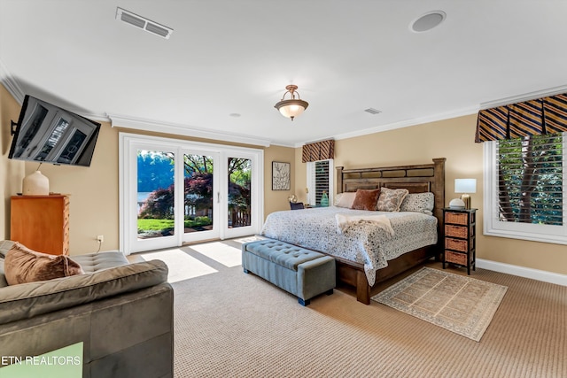 bedroom featuring access to outside, multiple windows, carpet, visible vents, and ornamental molding