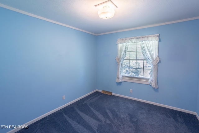 23 Windhaven Ln, Oak Ridge, TN 37830 - spare room with dark colored carpet, baseboards, and ornamental molding