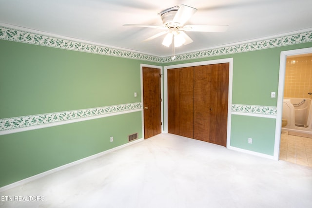 23 Windhaven Ln, Oak Ridge, TN 37830 - unfurnished bedroom featuring visible vents, a closet, carpet flooring, ceiling fan, and ensuite bathroom