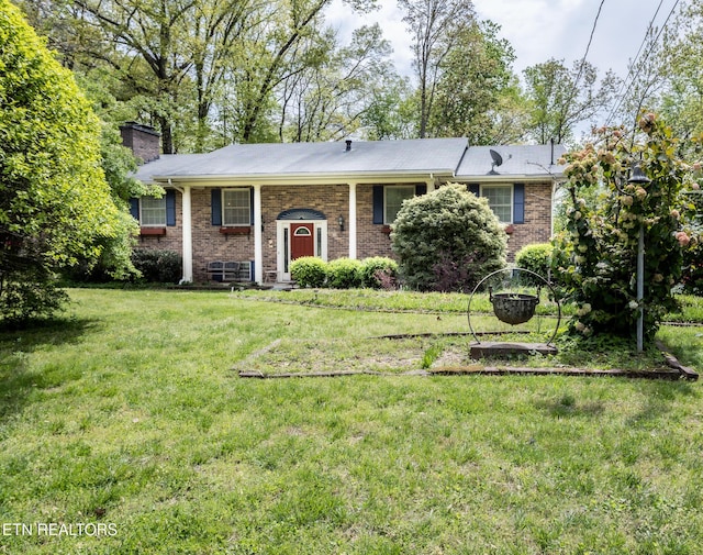23 Windhaven Ln, Oak Ridge, TN 37830 - bi-level home featuring a front lawn, a chimney, and brick siding