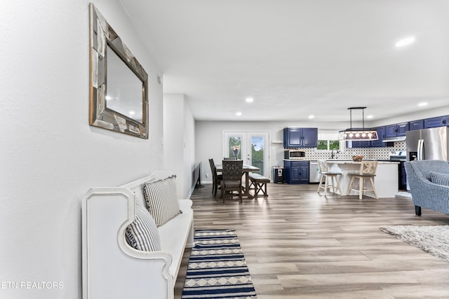 living room with wood finished floors and recessed lighting