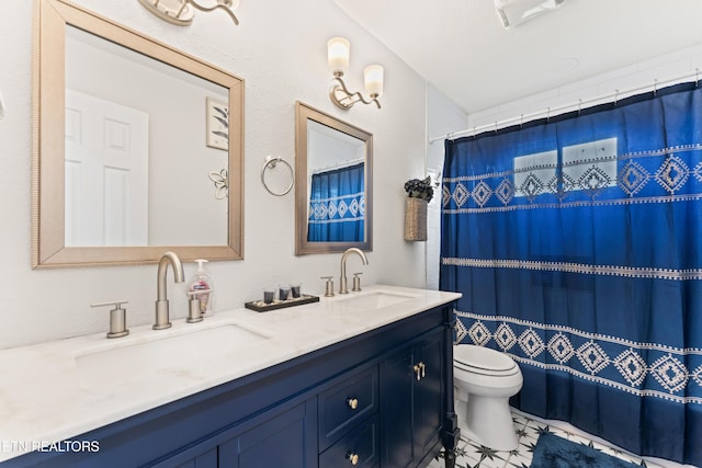 full bathroom featuring toilet, tile patterned flooring, a sink, and double vanity