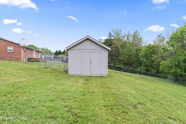 view of shed featuring fence