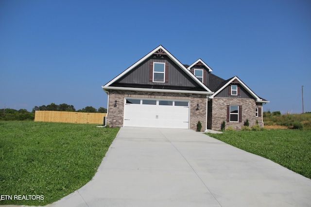 240 Lakeside Meadows Cir, Madisonville, TN 37354 - craftsman inspired home featuring driveway, a garage, brick siding, and board and batten siding