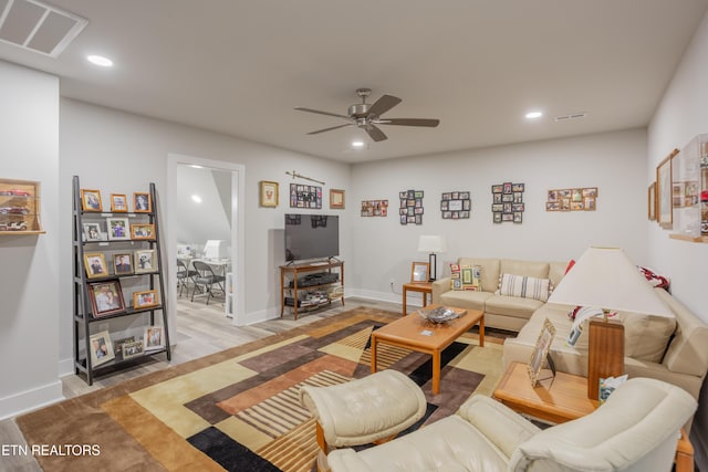 living area featuring recessed lighting, visible vents, and a ceiling fan