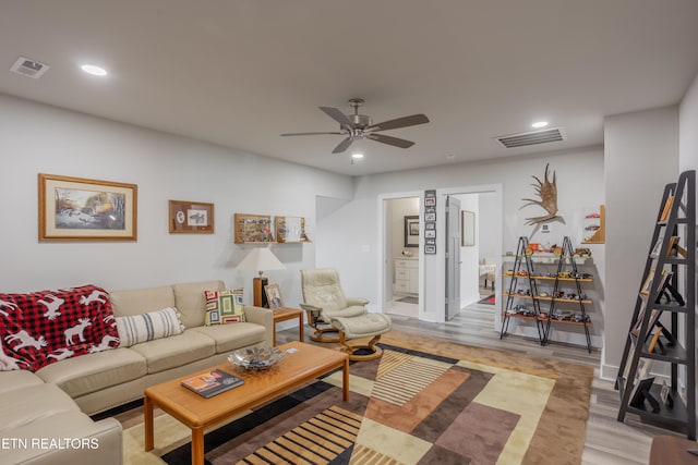 living area with visible vents, recessed lighting, and ceiling fan