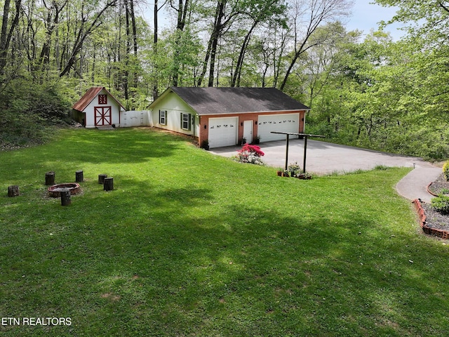 detached garage with a storage shed