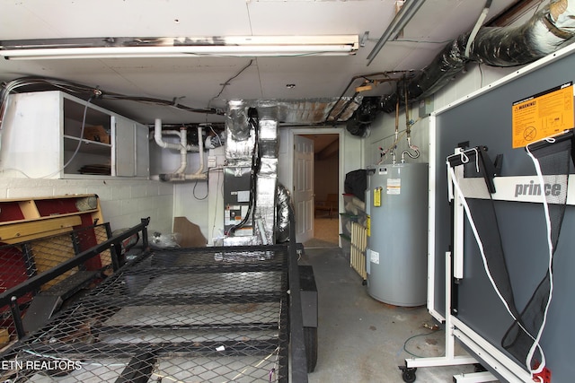 basement featuring water heater and heating unit