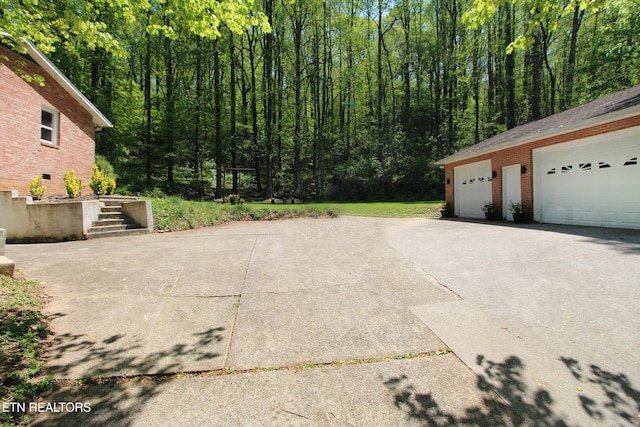 exterior space featuring a view of trees