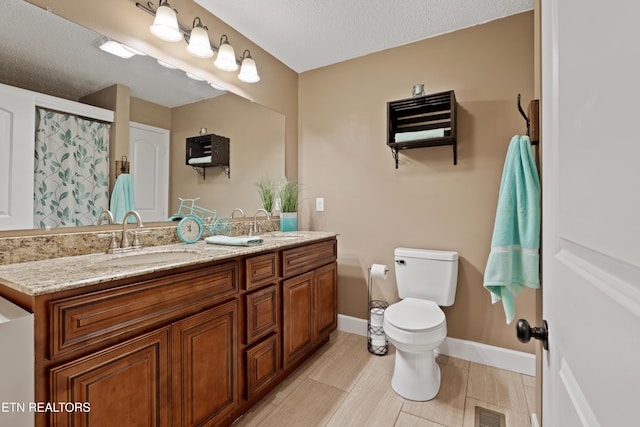 bathroom with visible vents, walk in shower, toilet, and a sink