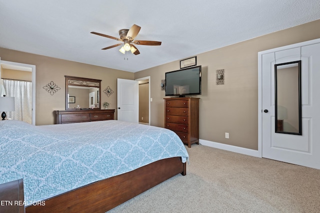 bedroom with ceiling fan, carpet floors, and baseboards
