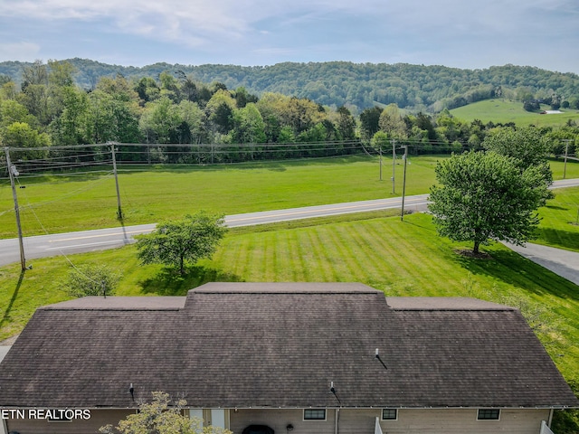 view of home's community featuring a lawn