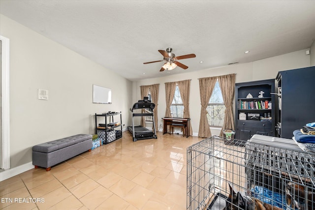 living area with recessed lighting, visible vents, light tile patterned floors, baseboards, and ceiling fan