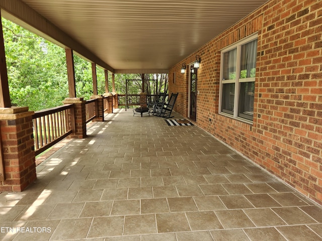 view of patio featuring a porch