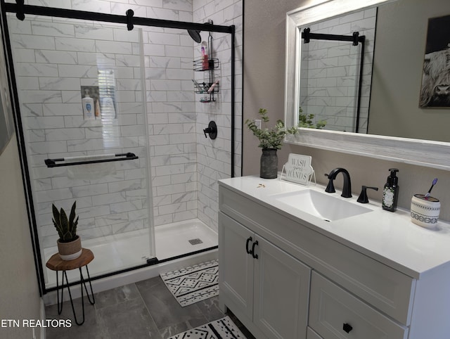 full bathroom featuring vanity and a stall shower