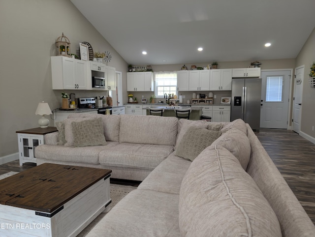living room featuring baseboards, recessed lighting, and dark wood-style flooring