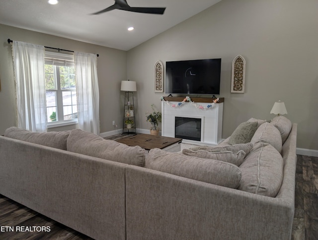 living area with dark wood-style flooring, vaulted ceiling, baseboards, recessed lighting, and a ceiling fan