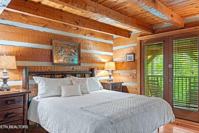 bedroom with wood walls, access to exterior, wooden ceiling, wood finished floors, and beamed ceiling