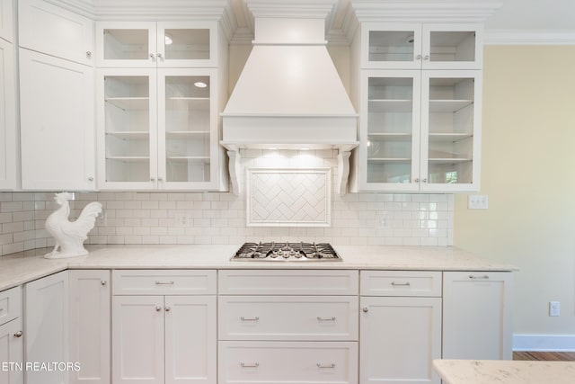 11969 Lakehurst Ln, Knoxville, TN 37934 - kitchen featuring stainless steel gas cooktop, custom exhaust hood, crown molding, and white cabinetry