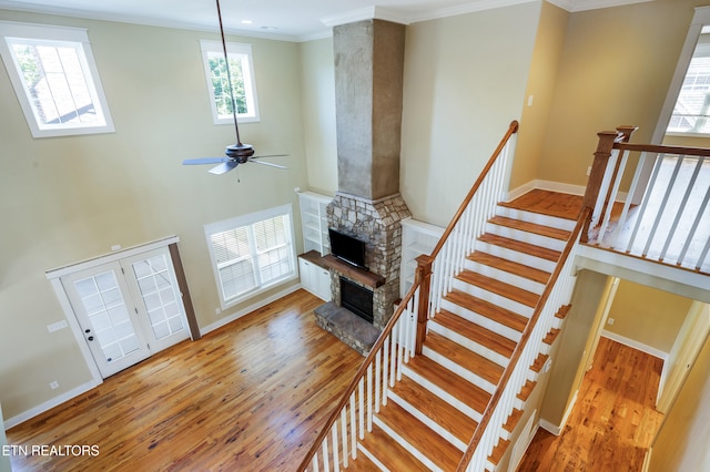 11969 Lakehurst Ln, Knoxville, TN 37934 - living area with wood finished floors, ornamental molding, a fireplace, ceiling fan, and baseboards