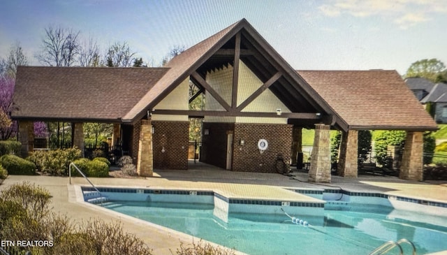 11969 Lakehurst Ln, Knoxville, TN 37934 - community pool featuring an outdoor structure, a storage structure, and a patio