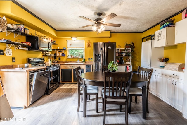 kitchen featuring ceiling fan, a textured ceiling, crown molding, open shelves, and stainless steel appliances
