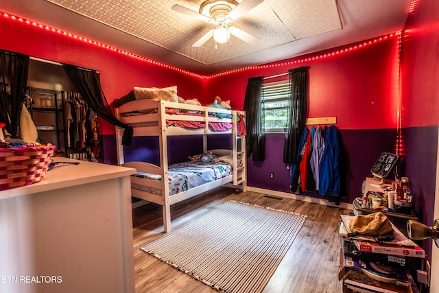 bedroom with wood finished floors