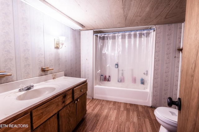full bath with vanity, wallpapered walls, toilet, and wood finished floors