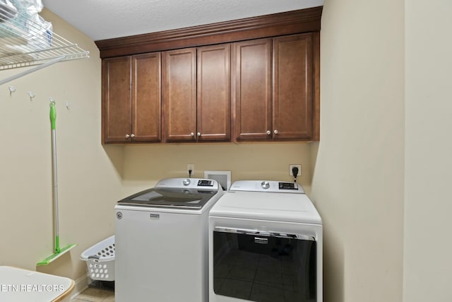 3317 Parrish Hill Ln, Knoxville, TN 37938 - clothes washing area with cabinet space and washer and dryer