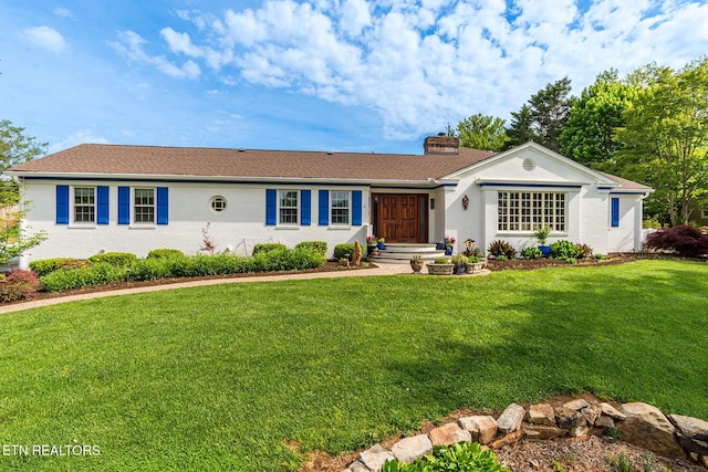 ranch-style house with a chimney and a front yard