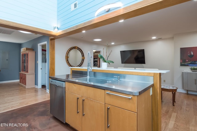 kitchen featuring stainless steel dishwasher, a sink, visible vents, stainless steel countertops, and dark wood-style flooring