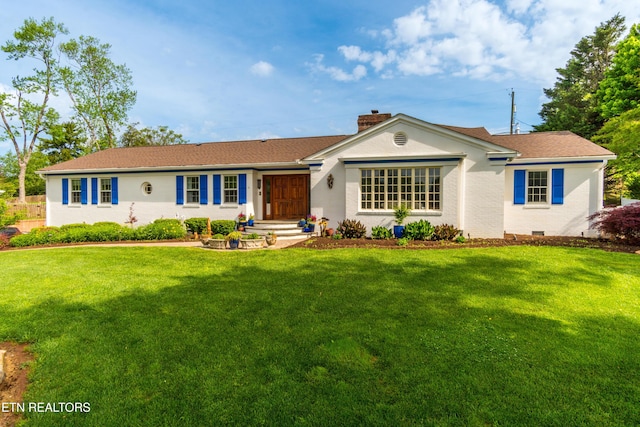 single story home featuring a chimney, a front yard, and crawl space