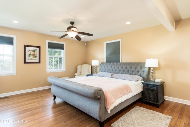 bedroom featuring recessed lighting, visible vents, wood finished floors, and baseboards