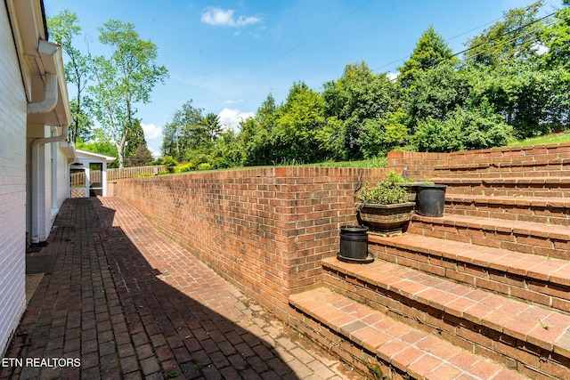 view of yard featuring a patio and fence