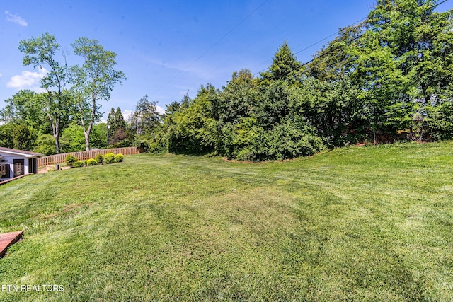 view of yard featuring fence