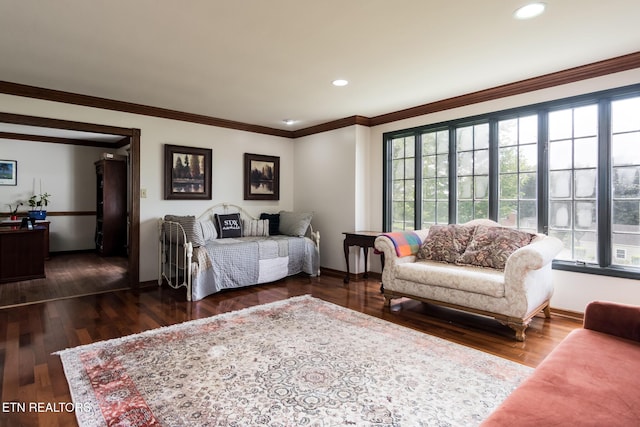 bedroom with dark wood-style floors, baseboards, and multiple windows