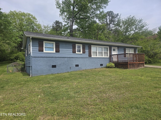 single story home featuring crawl space, a front lawn, and a deck
