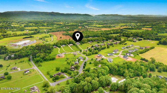 bird's eye view featuring a mountain view and a rural view