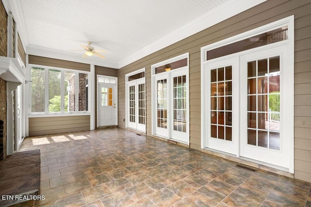 unfurnished sunroom with french doors
