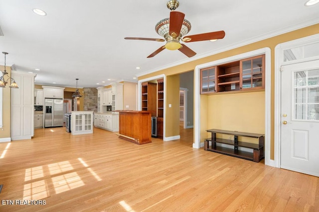 unfurnished living room featuring ornamental molding, recessed lighting, a ceiling fan, and light wood-style flooring